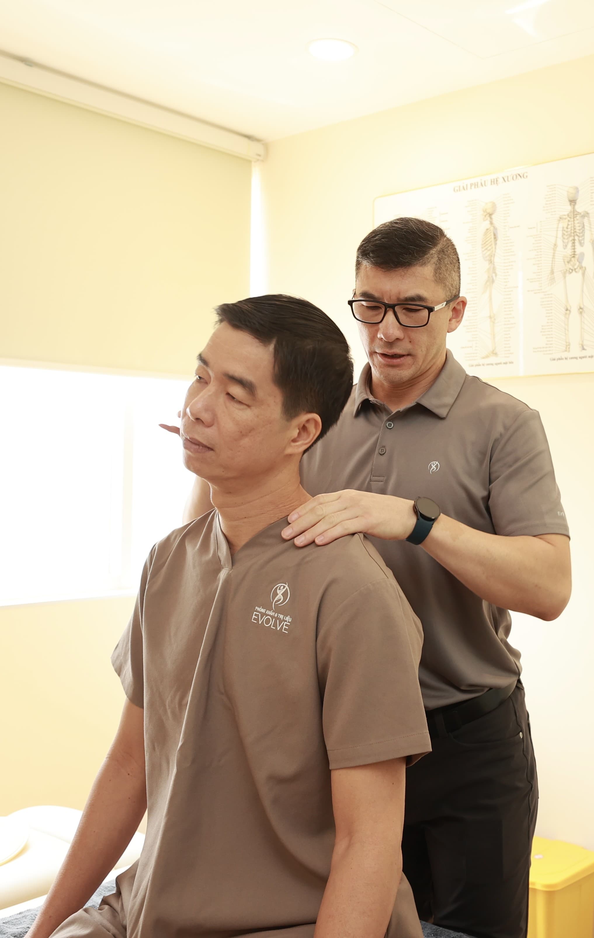 Practitioner providing manual therapy and leg manipulation to a patient